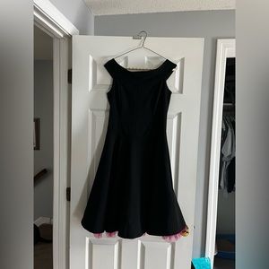 Black dress with pink frill.